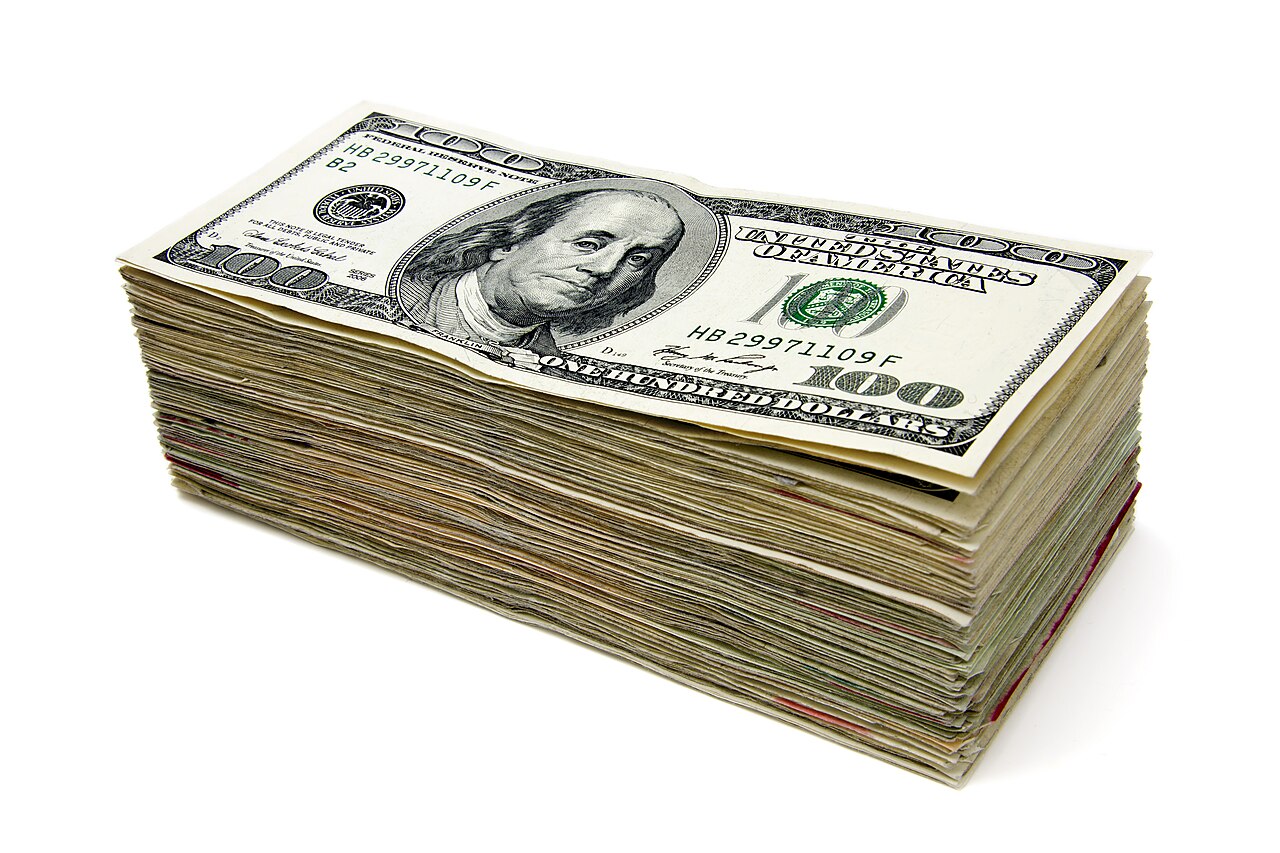 A stack of $100 bills - what a fast payout actually looks like once it clears.