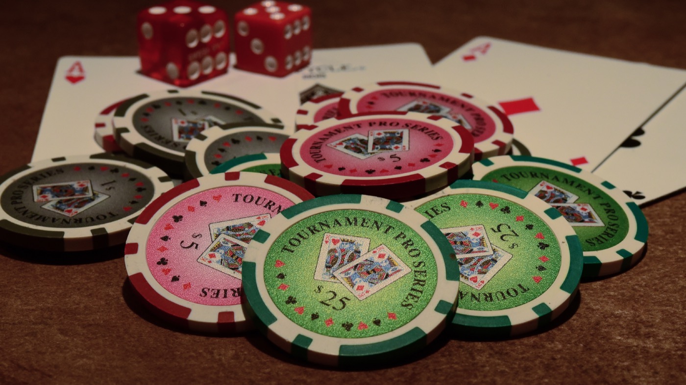Chips, cards, and dice - the classic building blocks of casino gaming, online or off. Photo by SharonLChapman, licensed CC BY 2.0.