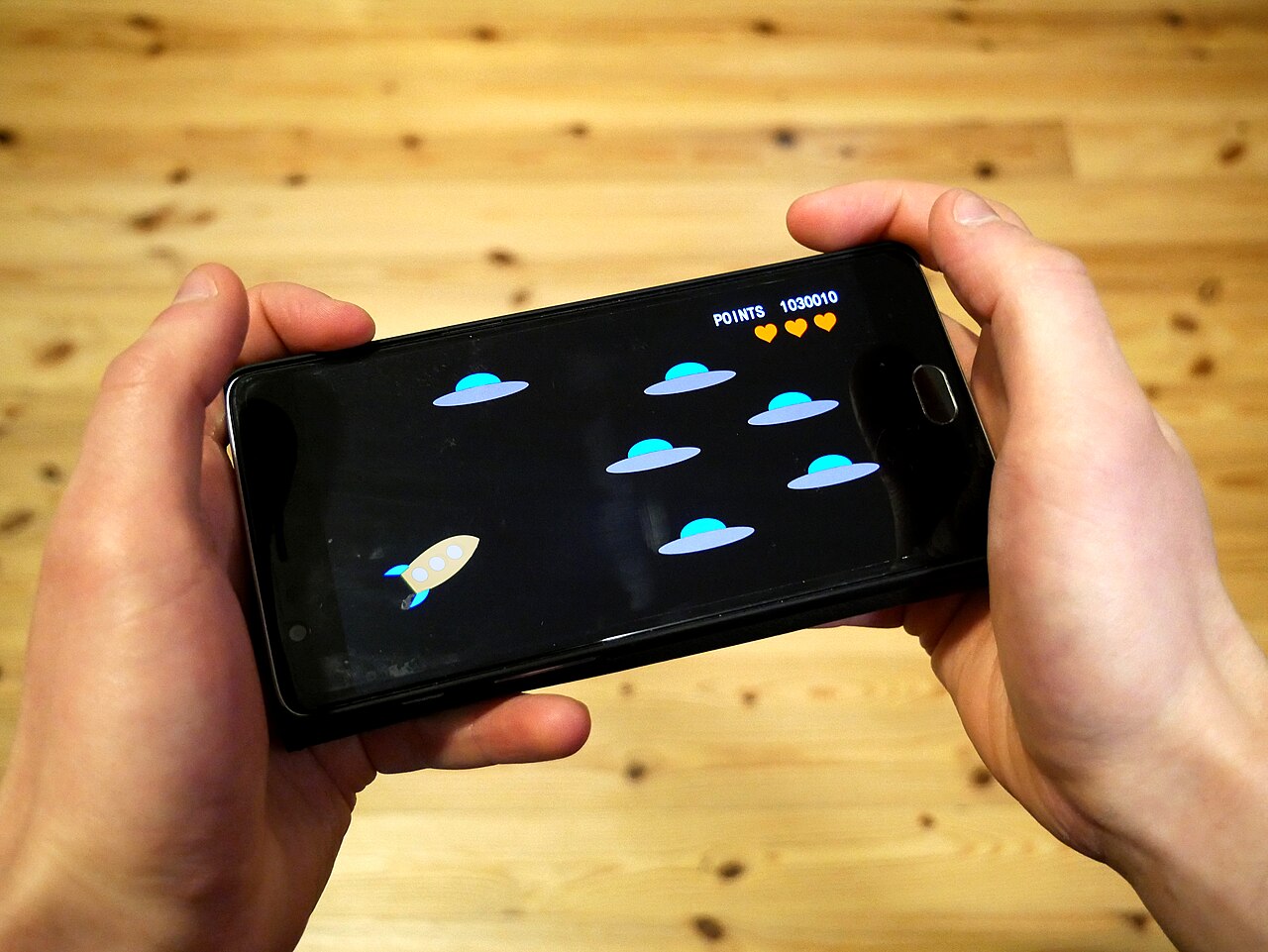 Playing a game on a smartphone - the same touch-first interface mobile casinos are built around.