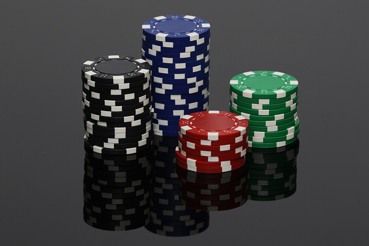 Stacked casino chips - deposit bonuses add extra chips to play with beyond your own money.